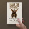 Funny Halloween invitation held in hand