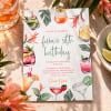 Cocktail Birthday Invitations on a sunny table with cocktails and tropical flowers