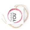 Frocked Up gift tag with a pink wine-glass ring on twine