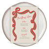 Ribbon Christmas menu in the green colourway on a stoneware plate