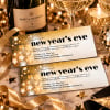 Starbright New Year's Eve invitations with champagne, gold ribbon and disco balls