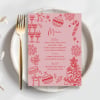 Whimsical Christmas Menus on a plate at a Christmas table setting