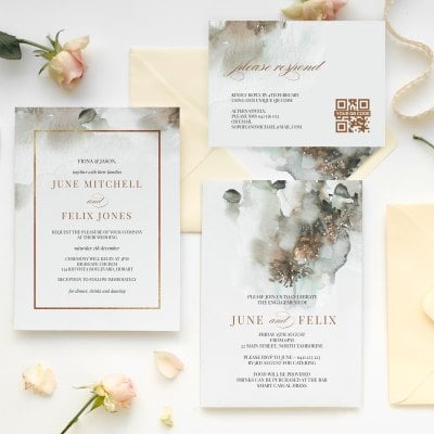 Formal wedding invitation suite styled with roses and envelopes